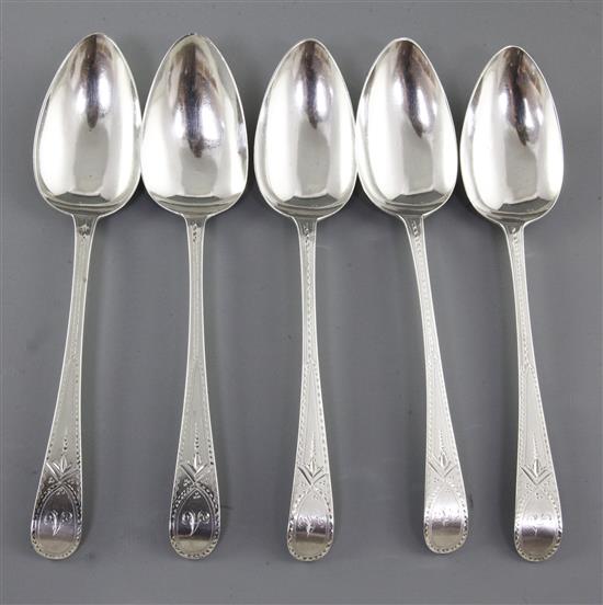 A set of five George III silver bright cut table spoons, Length: 8 ¼”/211mm Total Weight 7.3oz/207grms